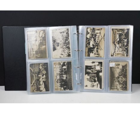 An album of photograph First World War postcards including a selection of ward photographs including Christmas examples, a 19