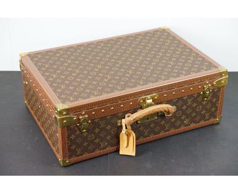 Louis Vuitton - Monogrammed canvas trunk with brass fittings and lock, opening to reveal beige interior complete with cream l