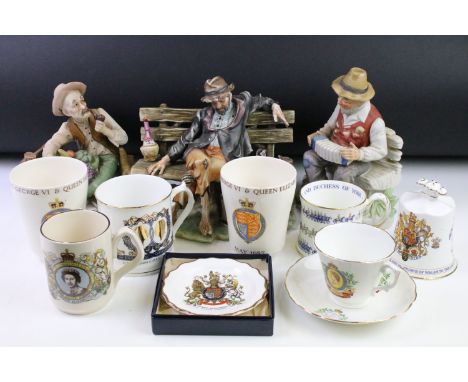 Group of three Italian Naples Capodimonte style figurines to include a man with a basket of fruit (marked N), tramp of bench 