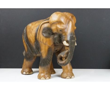 Carved teak model of an elephant, approx 41cm high 