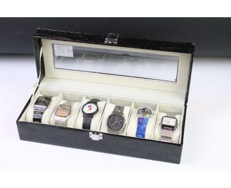 Group of six watches to include Seiko, Casio, Swatch &amp; Mickey Mouse examples, housed within a display case 