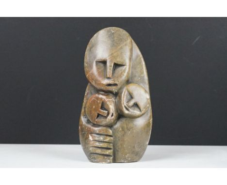 Zimbabwean carved and polished Stone Sculpture of a stylised parent with two children, 18cm high 