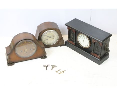 Gilbert, USA, japanned mantel clock, the dial set between two pairs of columns with faux marble mounts, the sides with scroll