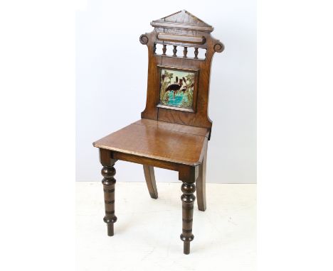 Victorian oak hall chair with Majolica inset tile to back, 90cm high x 44cm wide x 36cm deep 