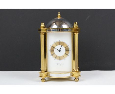 20th century Woodford brass chiming mantel clock of architectural form, with gilt chapter ring and black Roman numeraks, the 