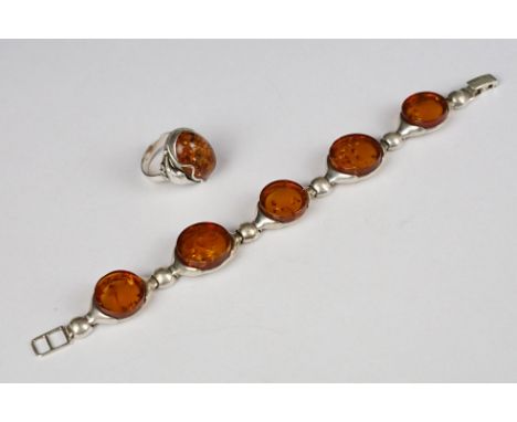 Silver and amber five panel bracelet, marked 925, 19.5cm long (extended) together with an Art Nouveau style ring with amber s