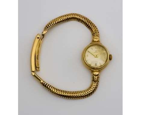 A Lady's Omega Manual Wind Wristwatch, 1960's, 9ct Gold Cased, 20mm diameter, the champagne dial with Arabic numerals, gold h