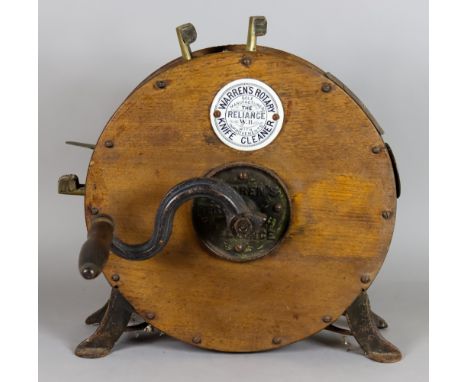 A Cast Iron and Oak "Warren's Rotary Knife Cleaner", Early 20th Century, 15.5ins high, two brass preserve pans, and a selecti