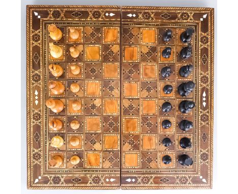 An English Mahogany Chessboard, 19th Century, the board of mahogany and satinwood squares, with a drawer housing a bone chess