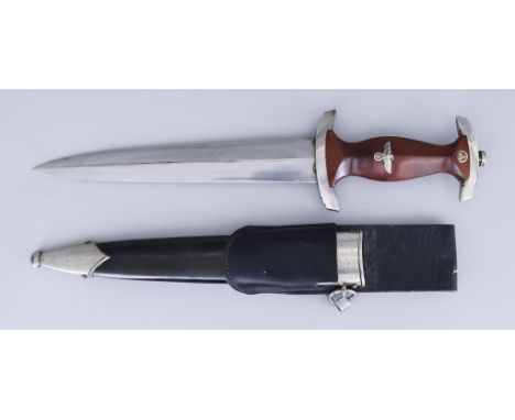 A German World War II NSKK Dagger, 8.5ins bright steel blade with no embellishment, brown grip, with enamelled NSKK badge, bl