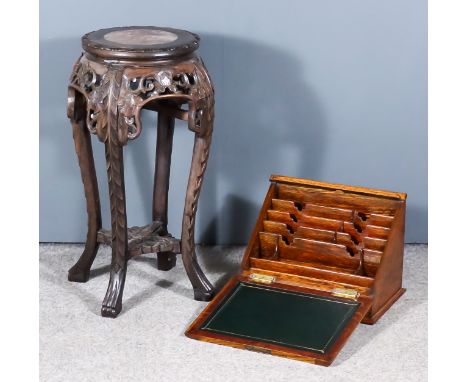 A Chinese Hardwood Circular Jardiniere Stand, with pink veined marble inset to top, the apron fretted and carved with flowers