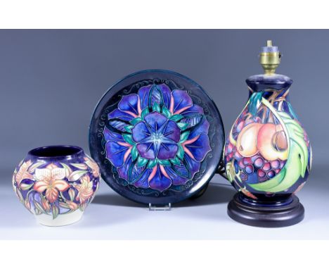 A Moorcroft Pottery Table Lamp with a fruit design, on turned base, 10.5ins overall, a Sian Leeper vase with flower design, 4