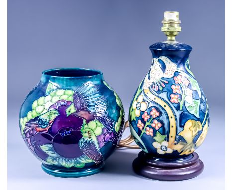 A Moorcroft Pottery Vase, with "Finch" design on a blue ground, designed by Sally Tuffin, introduced 1989, 6.75ins high, and 