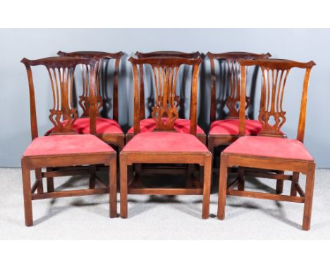 A Set of Six Mahogany Dining Chairs of "Country Chippendale" Design, with shaped crest rails, fretted vase pattern splats, th