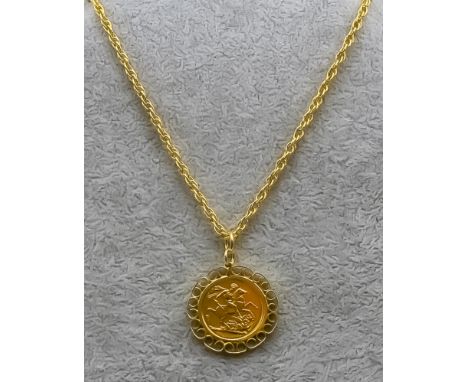 An Elizabeth II 2017 Sovereign with obverse portrait by Jody Clark, in 9ct gold pendant mount, 540mm double chain link neckle