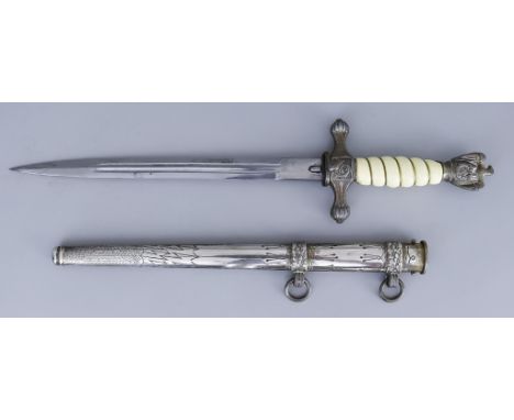 A German Naval Dagger, 10ins bright steel blade with no maker's name present, celluloid grip, plated cross guard and eagle, n