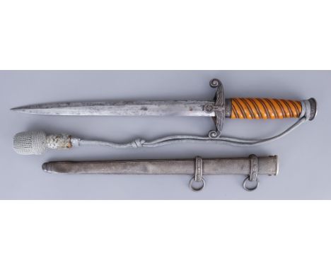 A German World War II Heer Dagger, 10ins bright steel blade, marked with maker's mark ACS over scales, celluloid grip, metal 