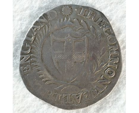 Commonwealth, 1653 shilling, 5.77 grams, 30.9mm, 9h, mintmark sun. Obv: Shield with St. George's cross on inside a wreath. Re