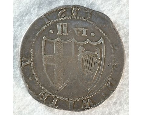 Commonwealth, 1653 halfcrown, 15.08 grams, 34.3 mm, 10h, mintmark sun. Obv: Shield with St. George's cross on inside a wreath