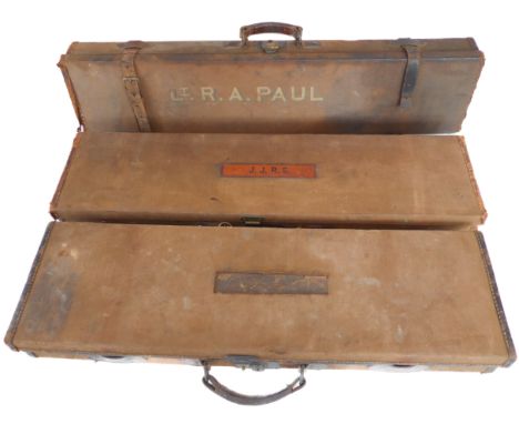 Three canvas and leather gun cases: 31", 32" and 34" external lengths, one with Army & Navy label.