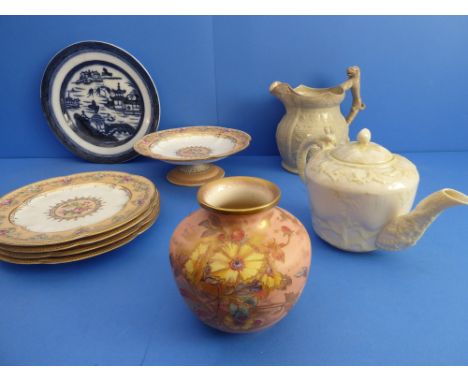 A selection of nine ceramics comprising:a 19th century Copeland dessert tazza;four Copeland matching plates (23.5cm diameter)