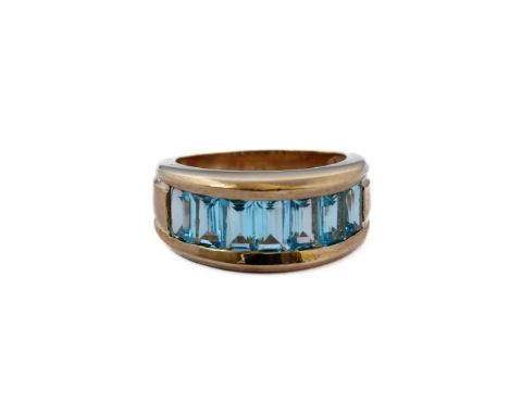 A heavy 9-carat gold band ring set with blue topaz, ring size J/KCondition Report: Under a normal loupe there are no major pr