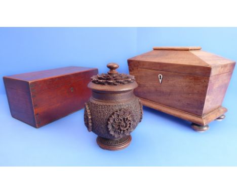 An early 19th century sarcophagus-shaped two-division faded rosewood tea caddy, together with a 19th century moneybox (former