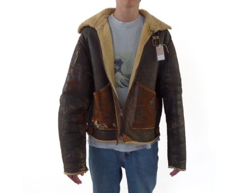 An original American WW2 brown-leather flying jacket (Type D, size large): in used condition with several rips, tears and old