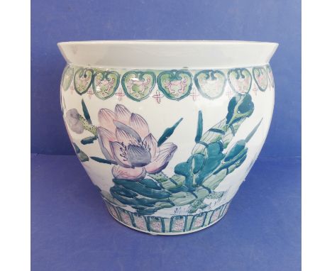 A large Chinese porcelain carp bowl/planter of ovoid form: the lip with key fret design above a band of ruyi heads (36.5cm di