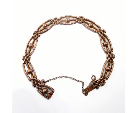 A 9-carat gold gate-style bracelet with safety chain