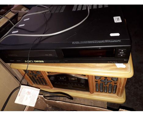 A prolectrux record player/radio and a Sharp video player. 