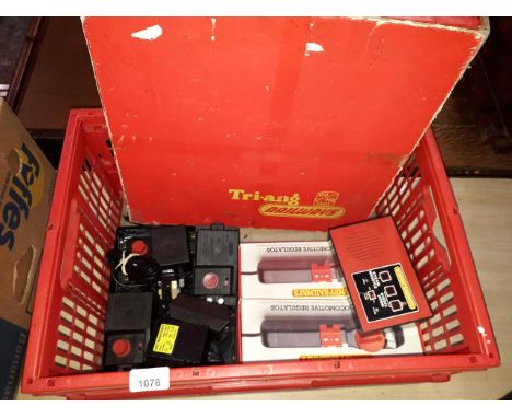 A box of Triang/Hornby model train accessories, including Loco regulators, train controllers, and part @hopper' set. 