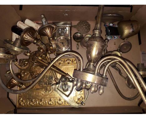 A box of brass including light fittings, clock, caddy spoon, bell, candlestick etc. 