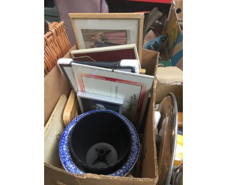 A box of prints and ceramic wall plaques 