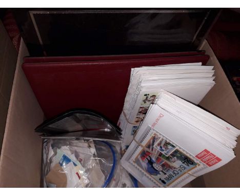 A box of stamp albums, British and Commonwealth, and first day covers and loose stamps. 