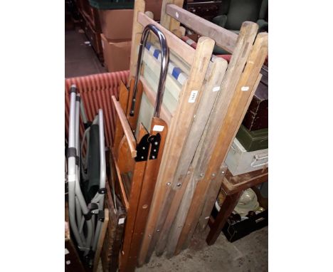 Six vintage deck chairs, wooden ladders, a folding table, a card table and a garden chair. 