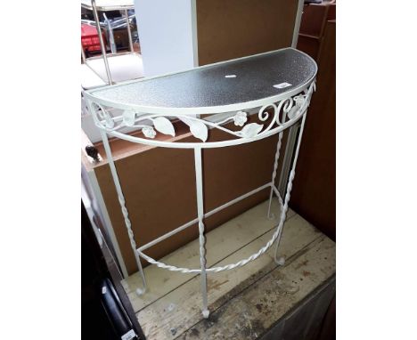 A wrought metal console table. 