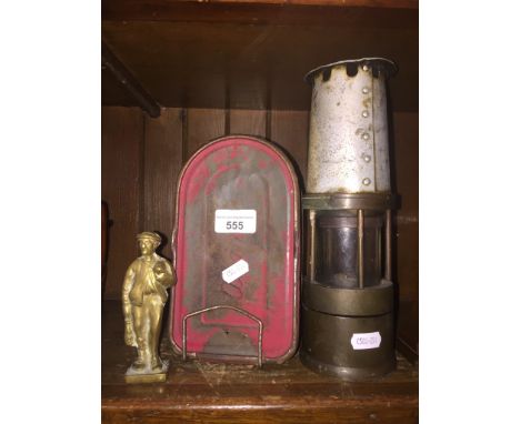 A vintage Naylors miners lamp, Acme sandwich box, and brass figure of a miner 