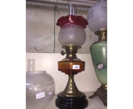 Victorian oil lamp with funnel and shadeCondition: minor surface wear to red painted decoration on flared rim of glass shade,