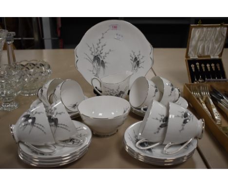 A Royal standard 'Giselle' part tea service, having black and white transfer pattern of leaves and  floral sprigs with silver