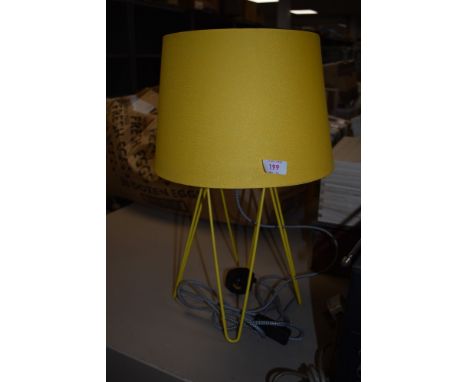 A yellow atomic style desktop or table lamp