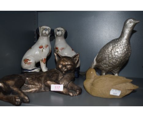 A collection of animal studies including ceramic dogs.