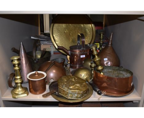 A large collection of vintage brass and copper items, including pans, hot water can, Funnels and other interesting items.