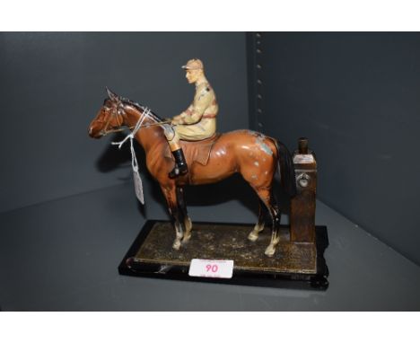An early 20th Century cast lighter modelled as race horse and jockey , approx. height 16cm, length 18cm
