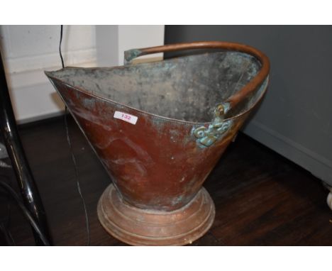 A copper coal bucket or helmet