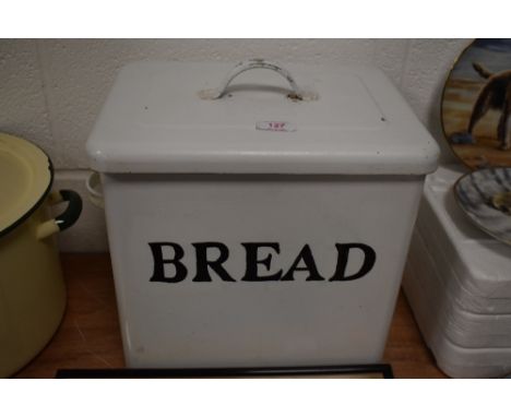 A vintage white enamel bread bin.