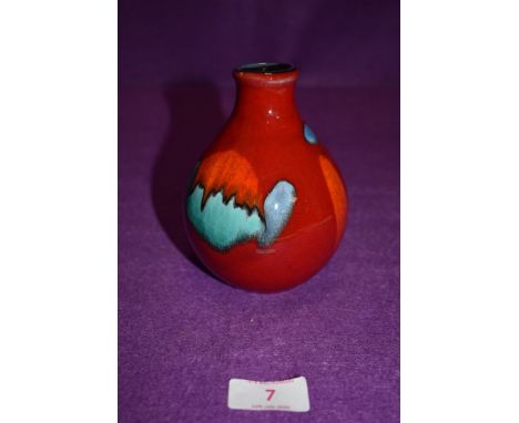 A Poole pottery jar of bulbous form having stylised blob decoration on a red ground
Condition report - 13cm high, widest poin
