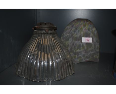 Two art deco lamp shades, one in mottled pink ,blue and green tones, the other clear with fluted sides.