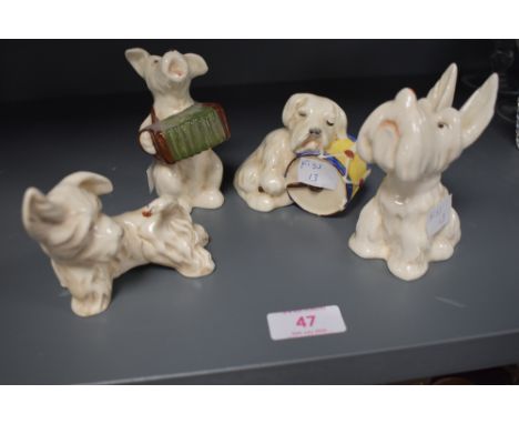 Four Beswick studies, Dog playing Accordion 811, Dog Asleep on Drum 812, Dog with Ladybird on Nose 813 and Dog with Ladybird 