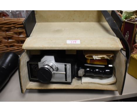 A Bell and Howell super eight film camera with case